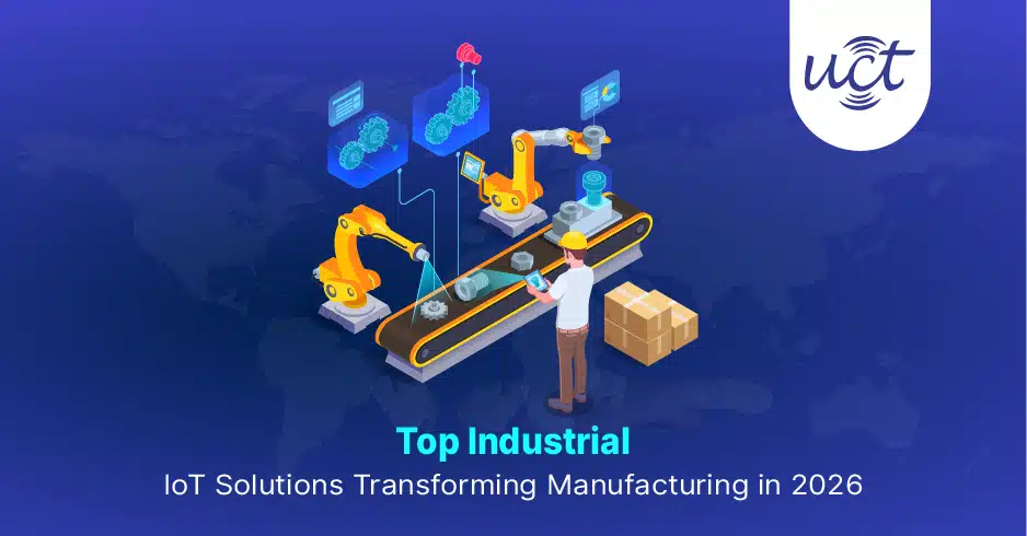 Technician using a tablet to monitor robotic arms and assembly line data, highlighting key industrial IoT solutions in manufacturing.